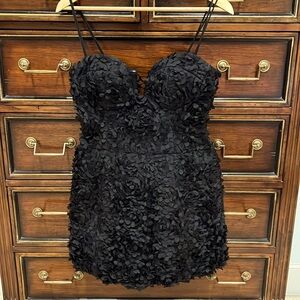 Super cute super sexy black cocktail dress with floral detail throughout